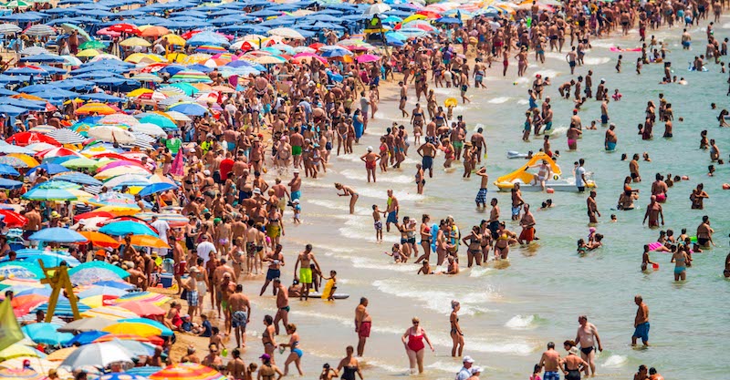 Summer Holiday Season Begins And Tourists Flock To The Beaches In Spain